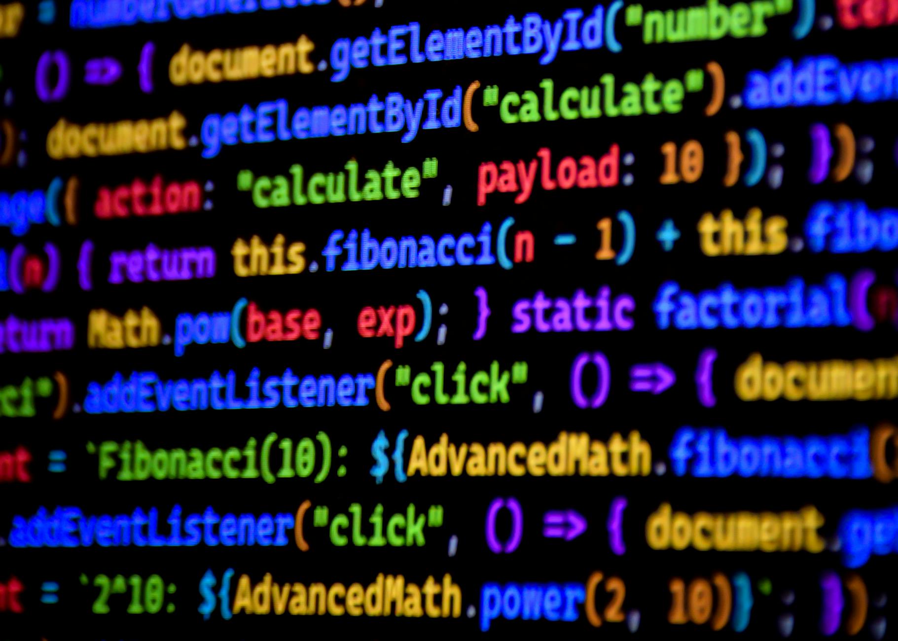 YAZILIM UZMANLIĞI EĞİTİMİ Sertifikası 1 Bright and colorful JavaScript code displayed on a computer screen, showcasing programming.