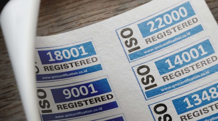 ISO 19011’e Göre Tetkik Programı Nasıl Hazırlanır? Adım Adım Rehber 1 ISO certification stickers with registration numbers on paper.